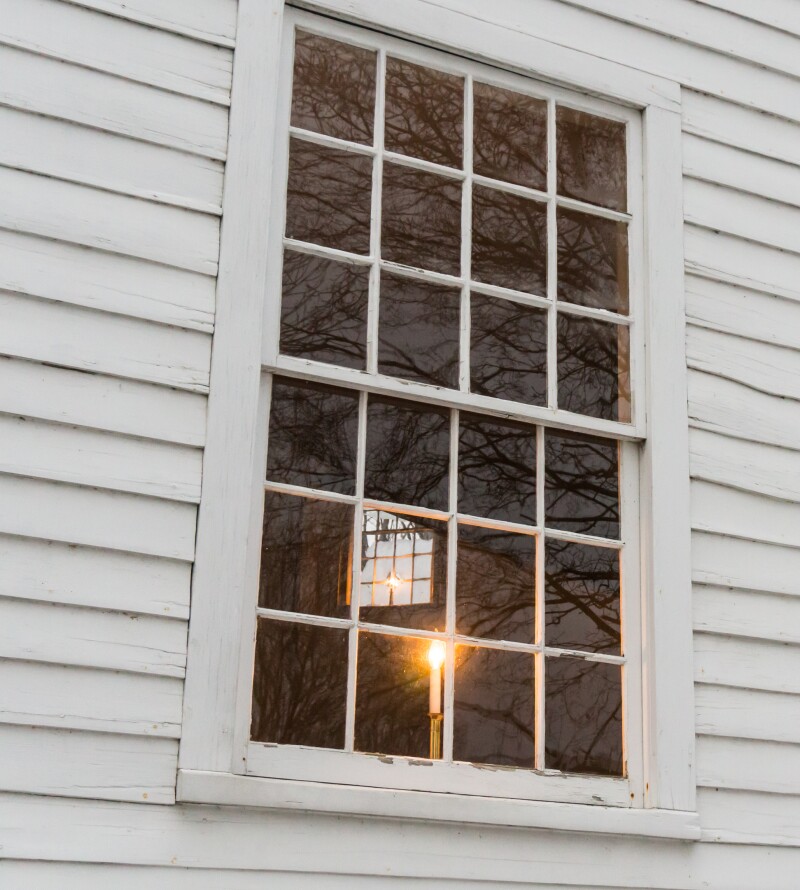A candle adorns a windowsill in Vermont.
