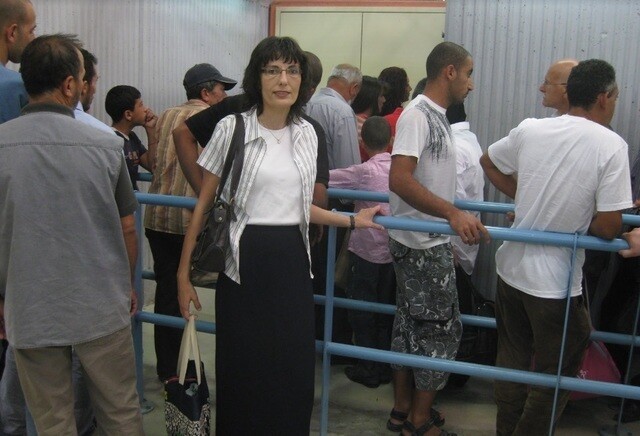 Sahar Qumsiyeh at the Israeli-Palestinian border. After waiting for hours at the border, Qumsiyeh would often be turned away, forcing her to risk her life sneaking into Jerusalem to attend church.