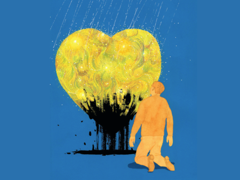 A man kneels in front of a glowing golden heart with black colors fading out from the bottom corner.