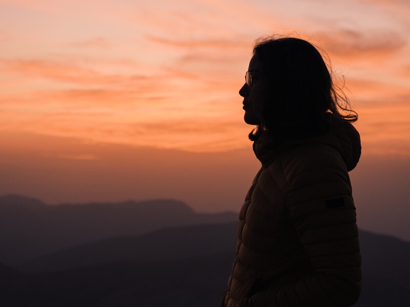 Side view of a woman silhouette during sunset in Jordan.