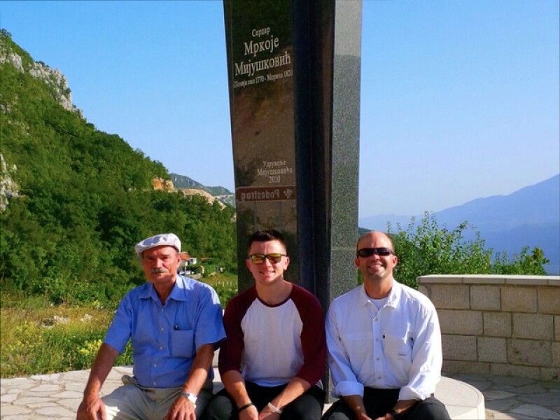 Jeff, his son, and Ilija in front of the Mijušković monument.