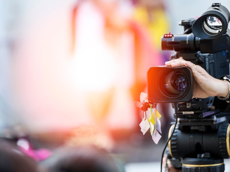 Video camera operator working with his equipment
