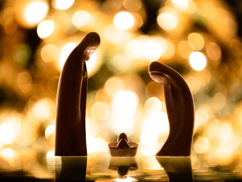 Christmas.,Wooden,Crib,With,Lights,Background.