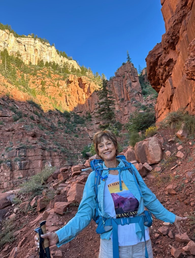 Fran posing in front of the canyon wall.