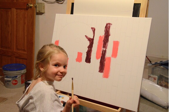 Emilie painting a picture