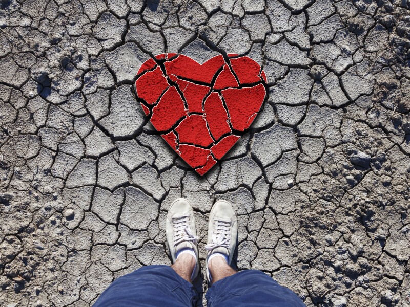 Lonely,Man,Standing,On,Dried,Soil,Ground,With,Illustrated,Cracked