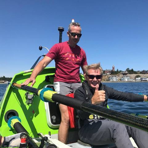 Alan Alderman and Tim Ryan on a rowboat.