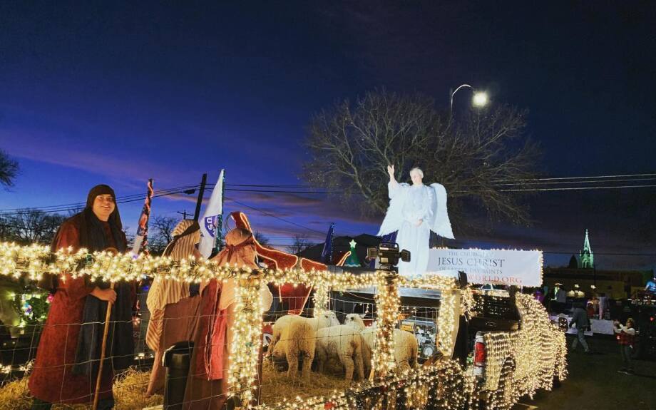 Inside the float, the angel delivers his message to the shepherds.