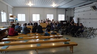 The Amish families meeting together as a Latter-day Saint group.