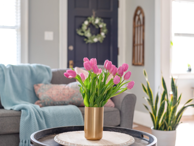 Cozy home sitting area with pink tulips