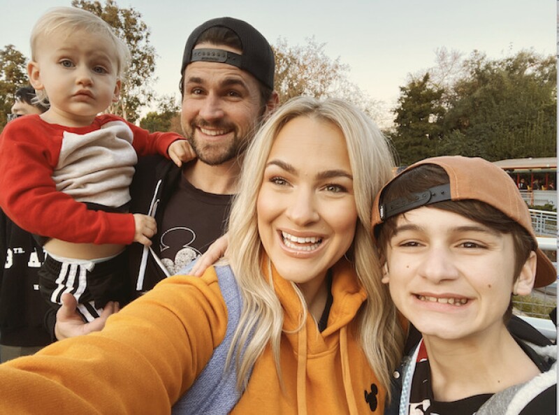 Brooke with her two boys and and her husband.