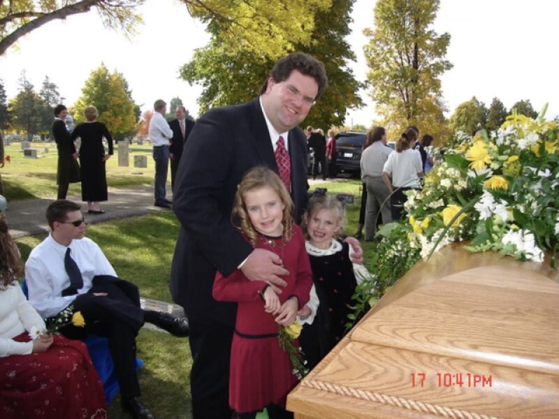 Anna with her dad and sister at her mom's funeral.