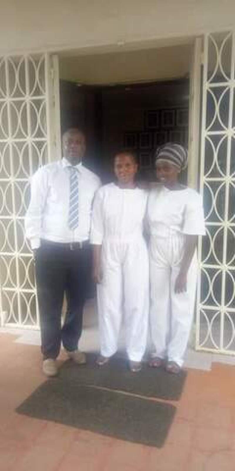 Susan and her daughter on their baptism day with Titus.