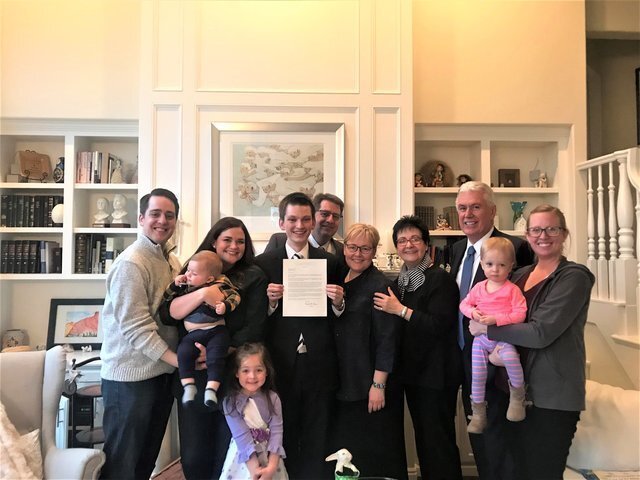 Elder Uchtdorf with his family as his grandson opened his mission call.