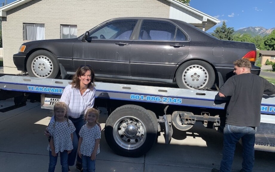 Brooke with the car she bought on eBay.