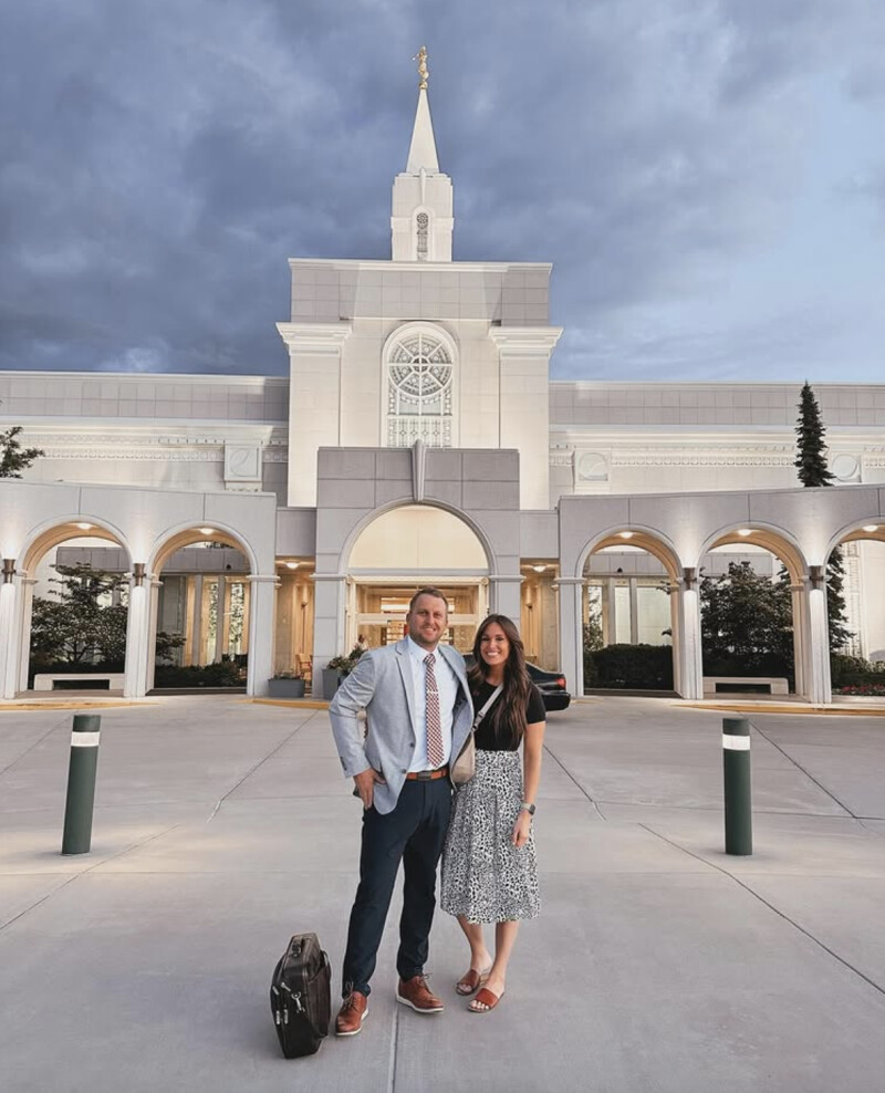 Ashly and Jesse Stone smile in front of the Bountiful Temple