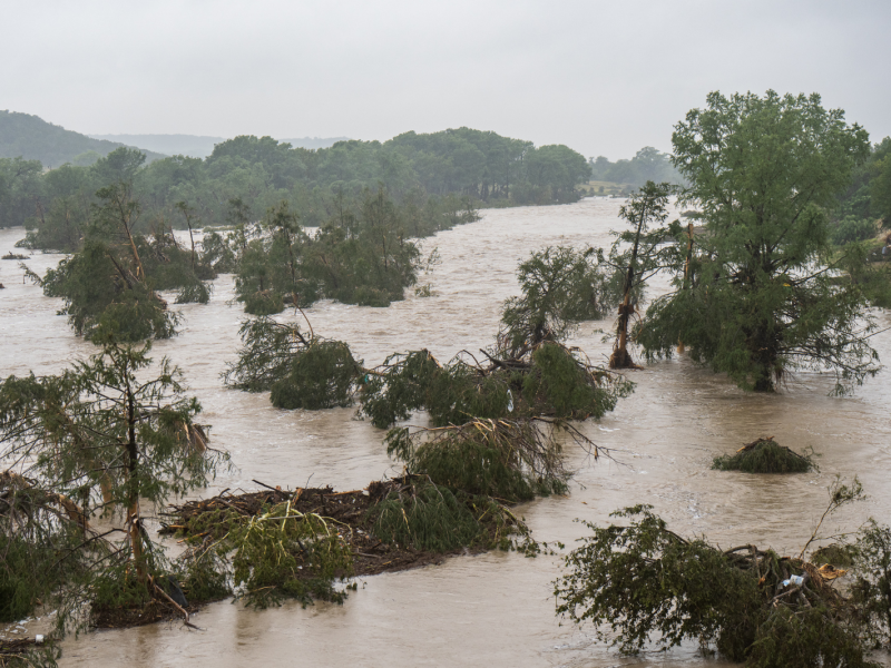 Trees emerge from flood waters along the Guadalupe River on July 4, 2025, in Kerrville, Texas.