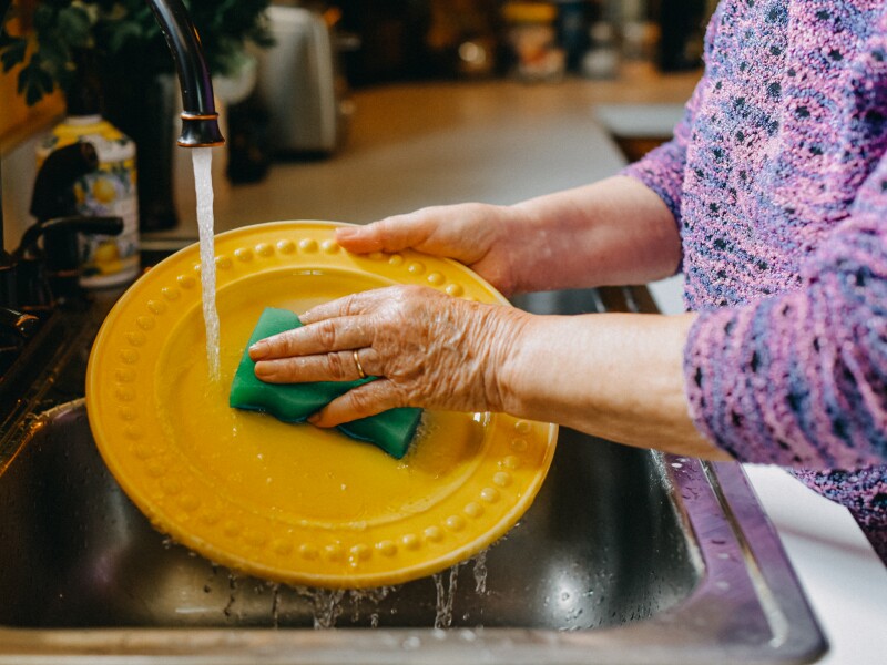 Senior Woman Washing Dishes