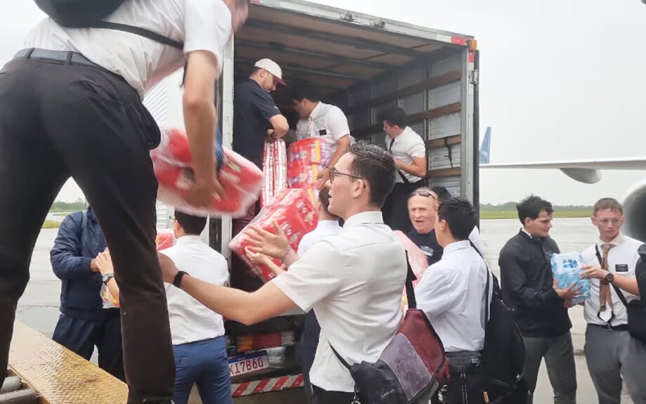 Missionaries from The Church of Jesus Christ of Latter-day Saints help unload emergency supplies from an Azul airplane at a military airport in Canoas, Brazil, following severe flooding in the Rio Grande do Sul state, Brazil.