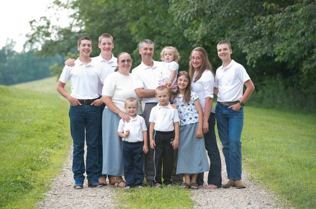 Paul and Mary Hochstetler (center) surrounded by their children.