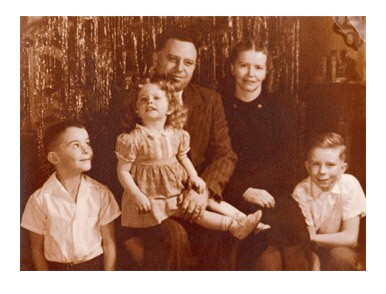 Image titleElder Cook with his parents, older brother, and younger sister. Image from lds.org.