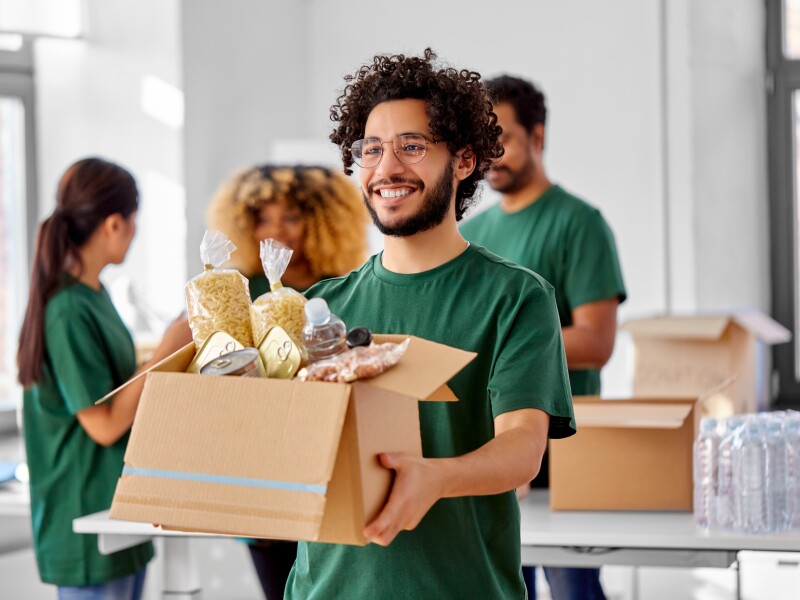 Charity,,Donation,And,Volunteering,Concept,-,Happy,Smiling,Male,Volunteer
