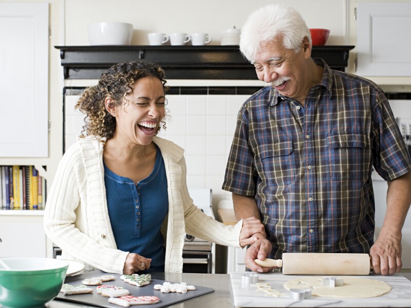 A father and daughter making cookies