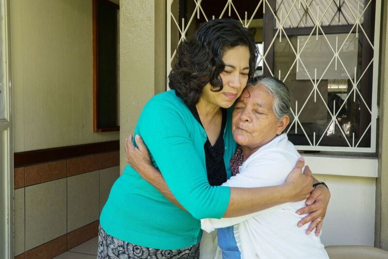 Reyna Aburto hugs a sister in Guatemala.jpeg