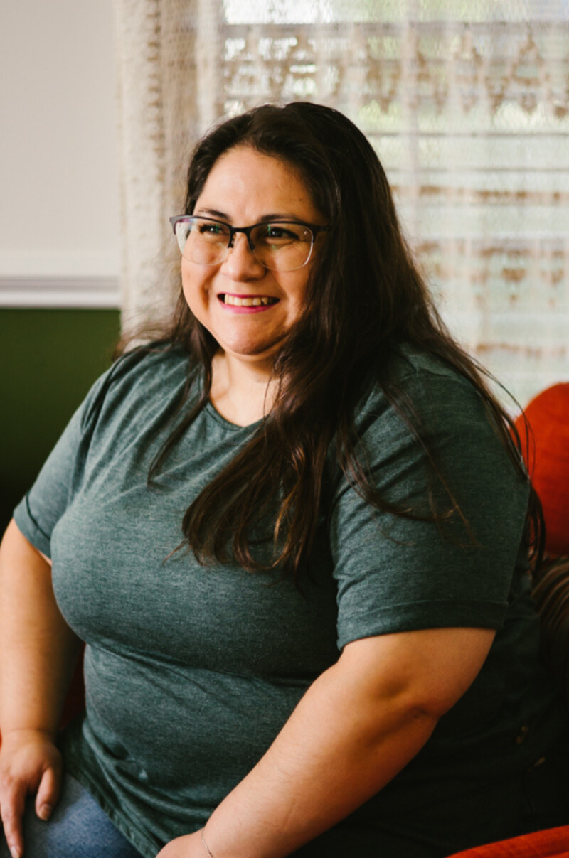 A portrait of a woman smiling.