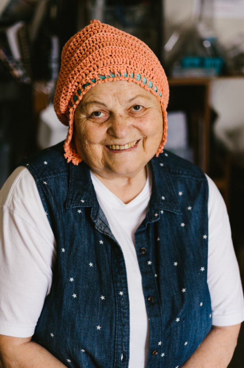A portrait of a woman smiling.