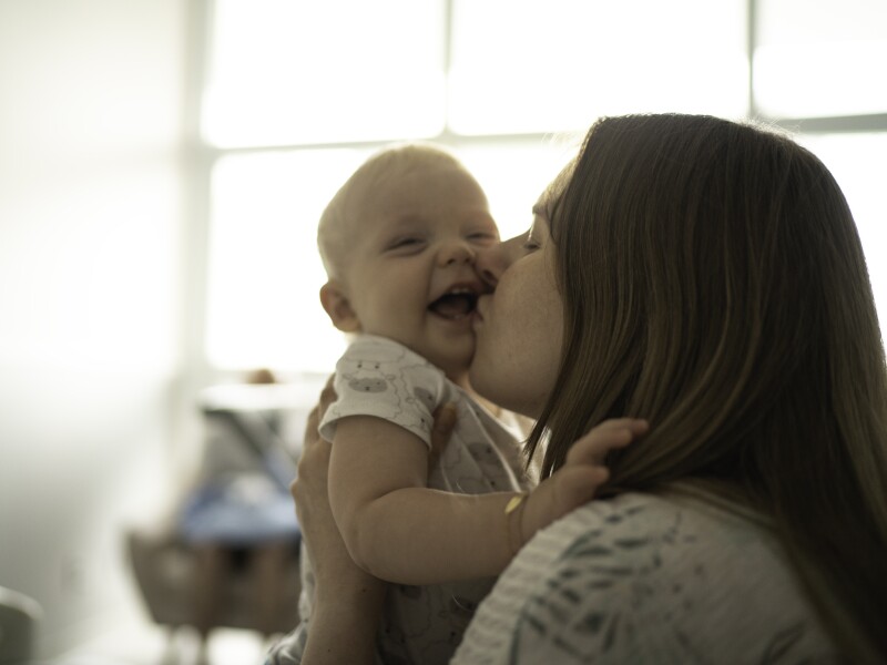Mother kissing her baby son