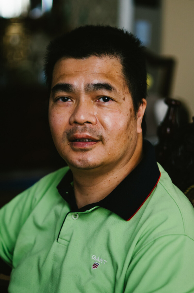 A portrait of a man smiling.