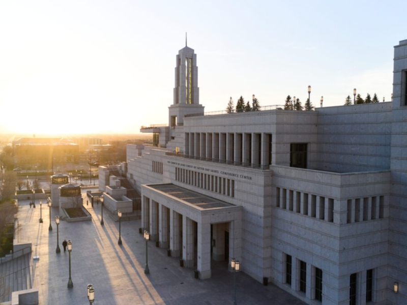 The sun sets behind the Conference Center of The Church of Jesus Christ of Latter-day Saints.