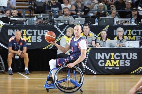 Retired Air Force Tech. Sgt. Joshua D. Smith plays with Team USA in a wheelchair basketball game at the 2018 Invictus Games in Australia in October.