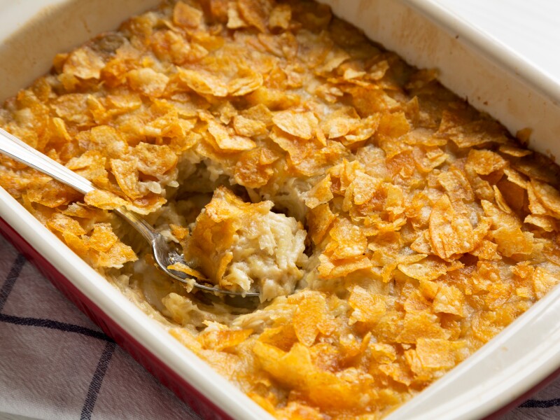 Home-baked,Funeral,Potatoes,Casserole,In,A,Dish,Over,White,Wooden