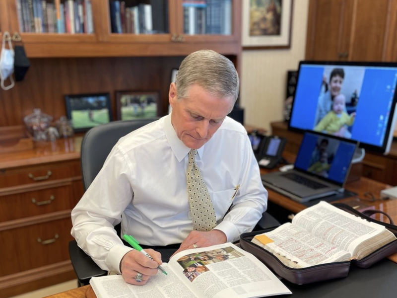 Elder Bednar studies at his desk.png