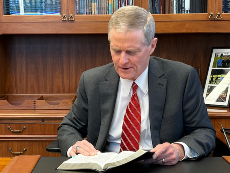 Elder David A. Bednar studies the scriptures.