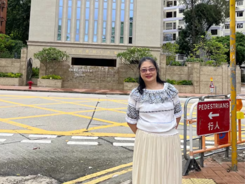 Chan Yiu Wu, who also goes by Yvonne Chan, stands in front of the Hong Kong Temple in May 2022.