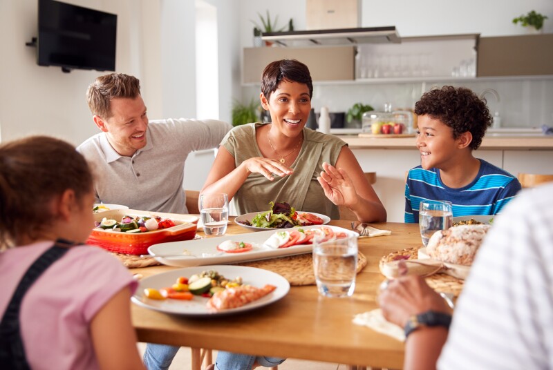Multi-generation,Mixed,Race,Family,Eating,Meal,Around,Table,At,Home