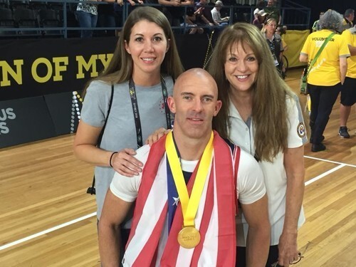 Retired Air Force Tech. Sgt. Joshua D. Smith with his wife, Michelle, left, and mother Becky Smith, right, at the 2018 Invictus Games in Australia in October.