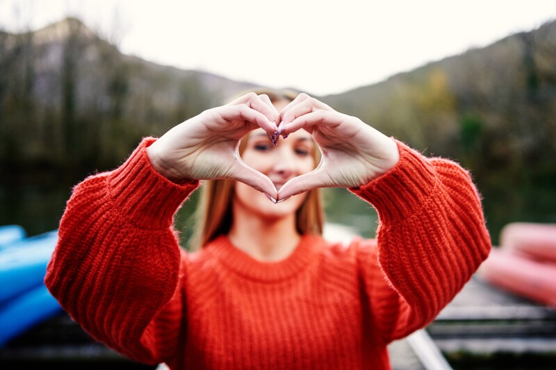 Detailed drawing of a hand making the shape of a heart.
