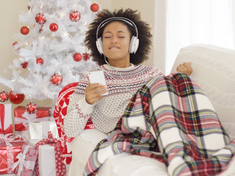 Happy,Woman,Listening,To,Music,On,Christmas,Day