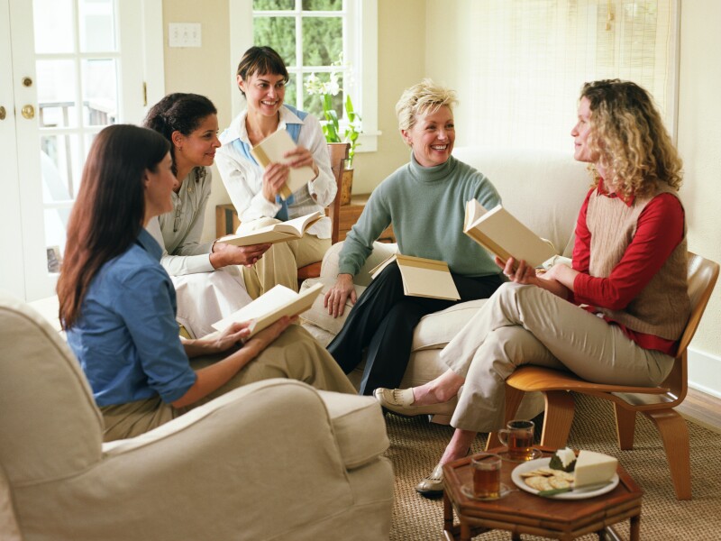 Women laughing in book club