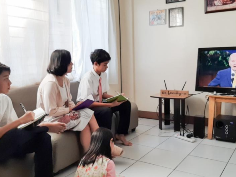 Family watching conference.png