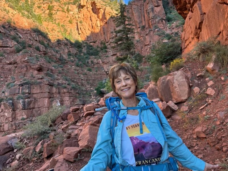 Fran posing in front of the canyon wall.