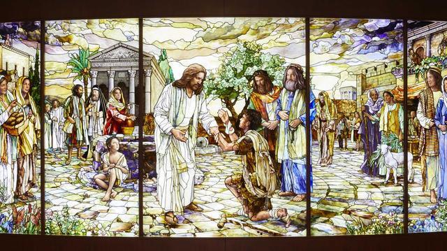 A stained-glass New Testament story of Jesus Christ ministering to those in need. The glass is located in the Rome Italy Temple Visitors’ Center.