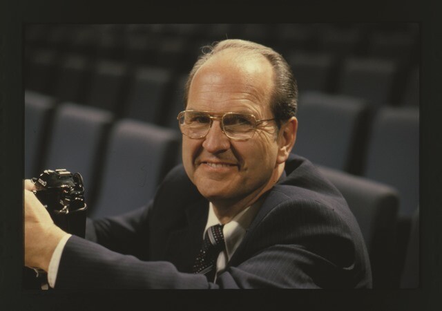 Russell M. Nelson holding a camera.