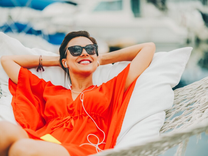 Woman in hammock feeling relaxed