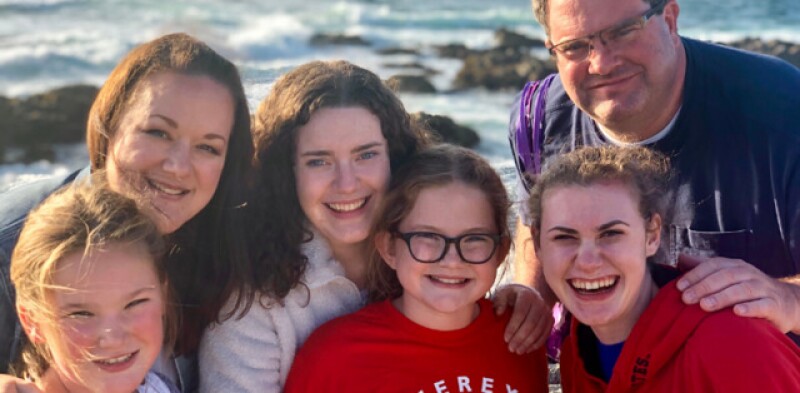 Tammy with her husband and four children at the beach.
