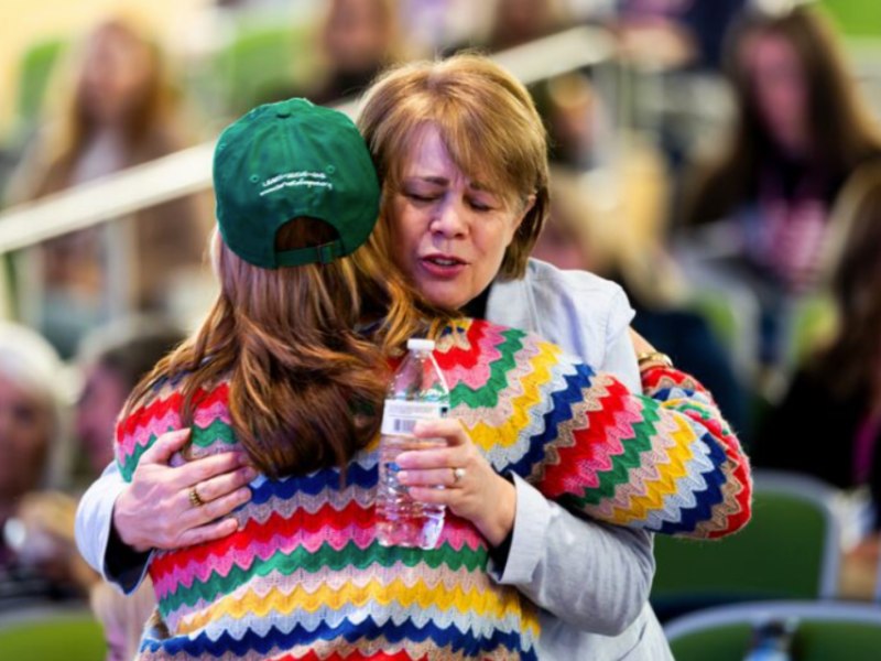 Sharon Eubank greets someone Mormon Women for Ethical Government conference at UVU